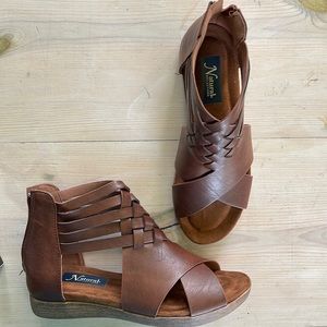 Brand new never been worn.  Natural reflections sierree Sandels.  Size 7